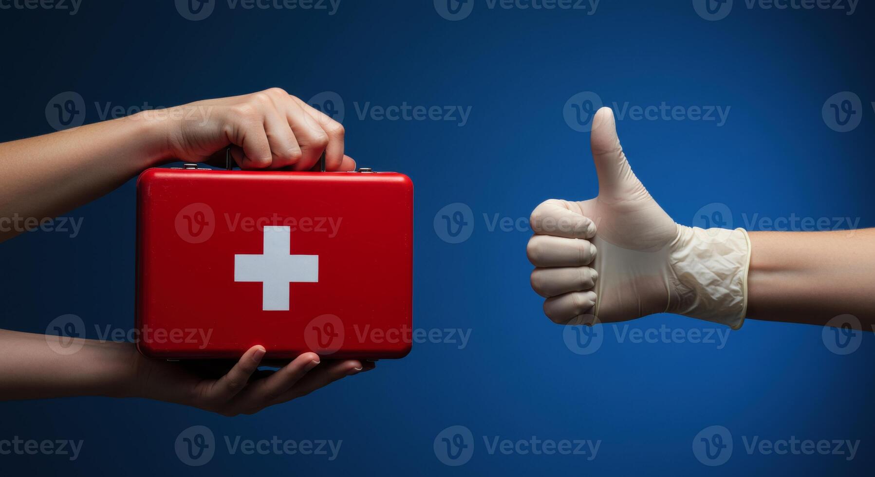 Female hand holding red first aid kit and medical hand with glove giving thumbs up photo