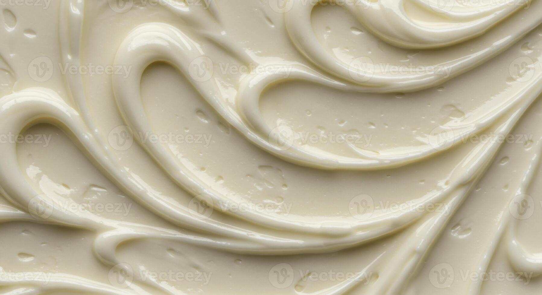Close up texture of white cream or frosting with swirling peaks photo