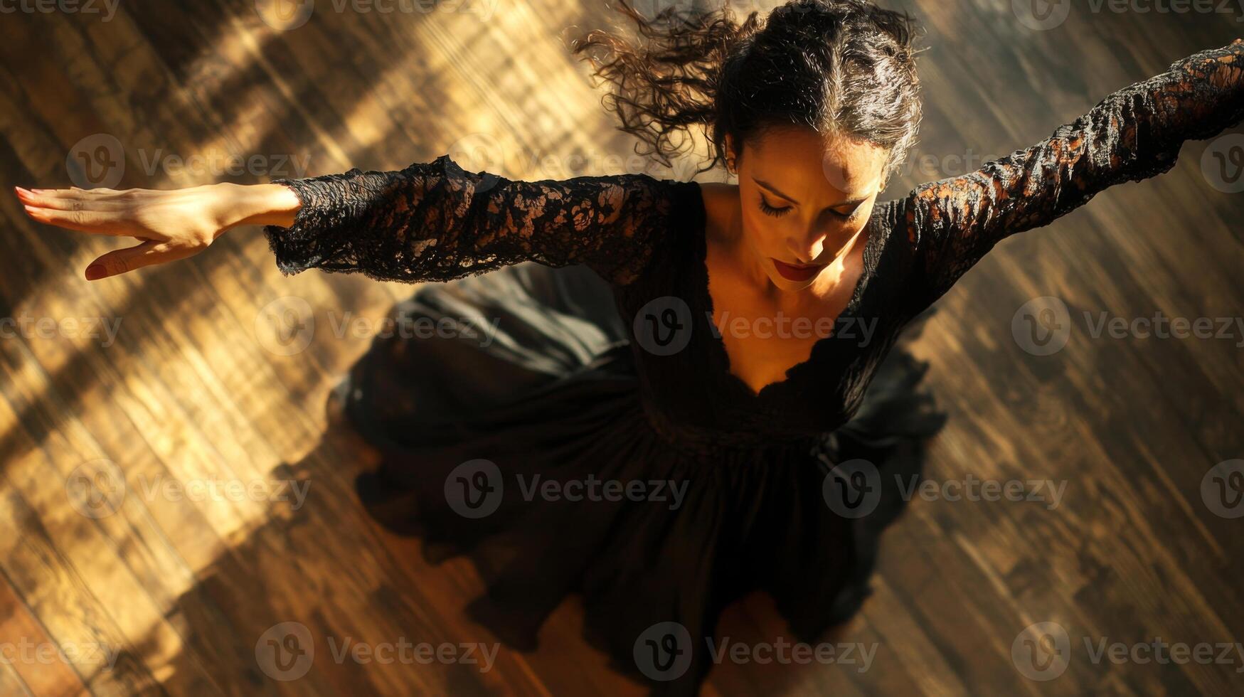 Woman in Black Dress Dancing on Wooden Floor photo