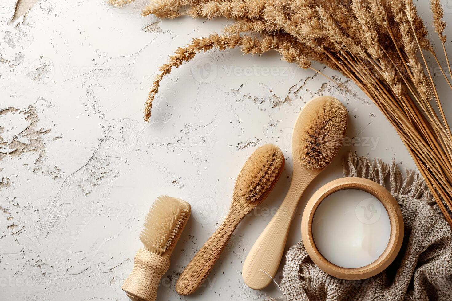 Bamboo toothbrush, wooden spoon and a bowl of wheat photo