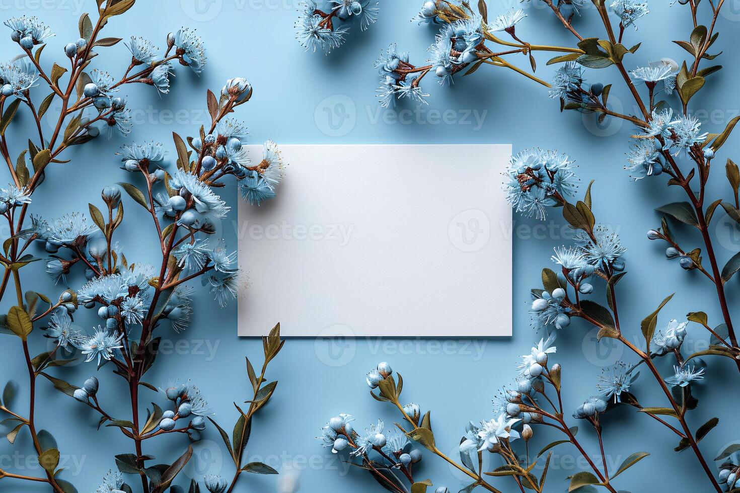 Blank card on blue background with blue flowers photo