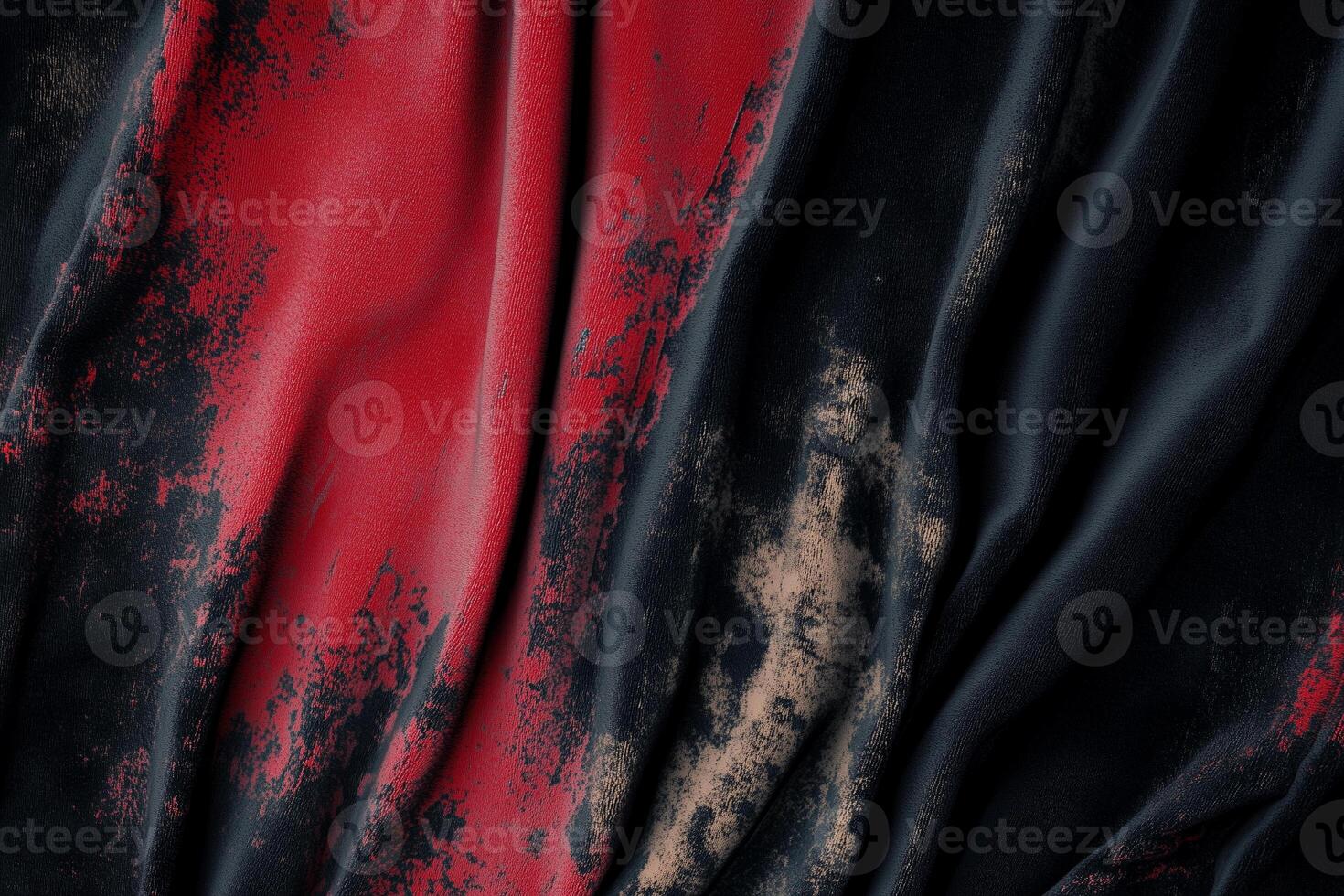 Sun-faded velvet fabric displaying unique nap wear patterns in deep red and black tones photo