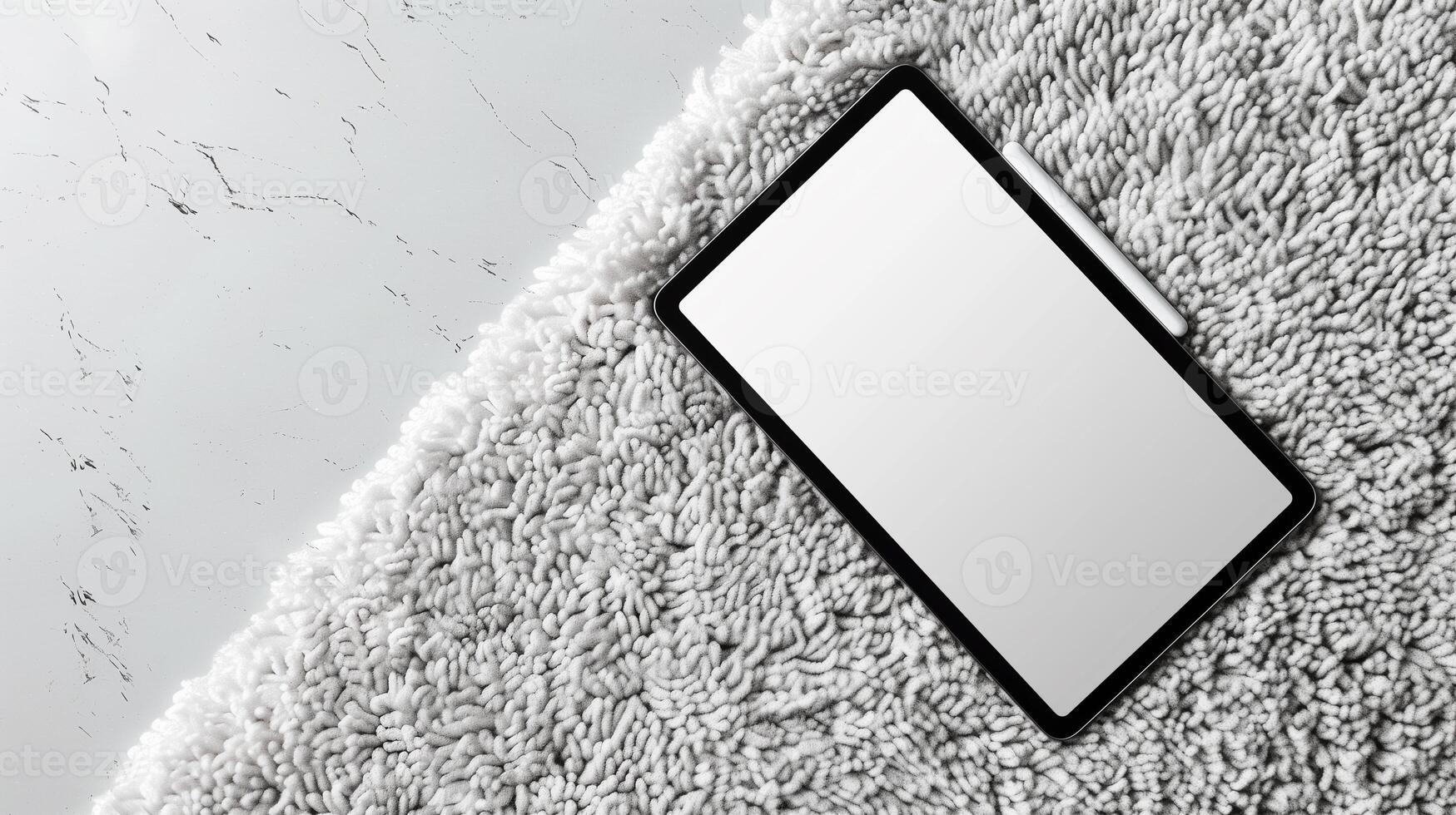 Minimalist iPad mockup laying on light gray carpet in overhead view showcasing a blank screen and aluminum body photo