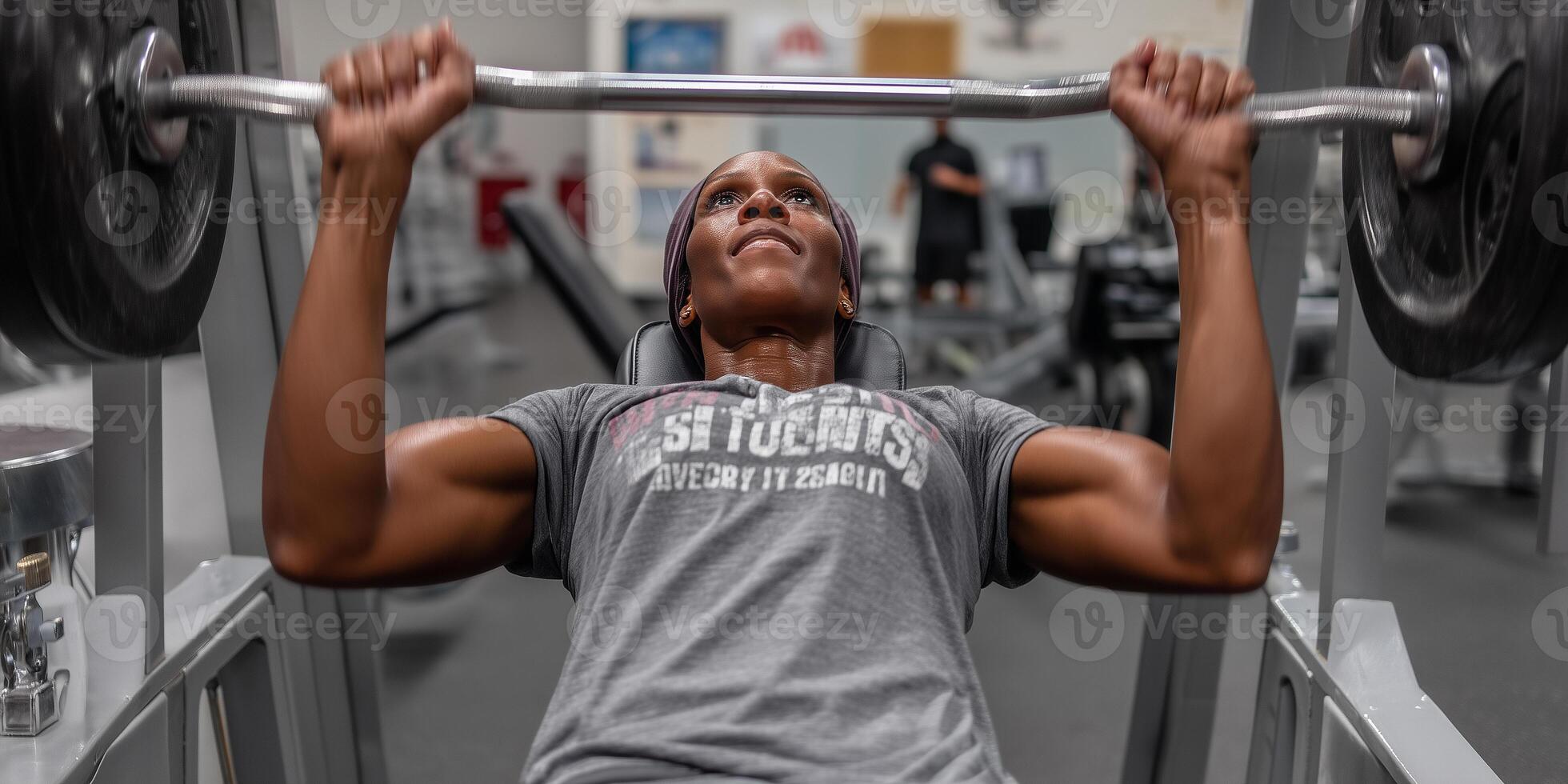 Focused individual performs chest press at gym showcasing determination and strength photo
