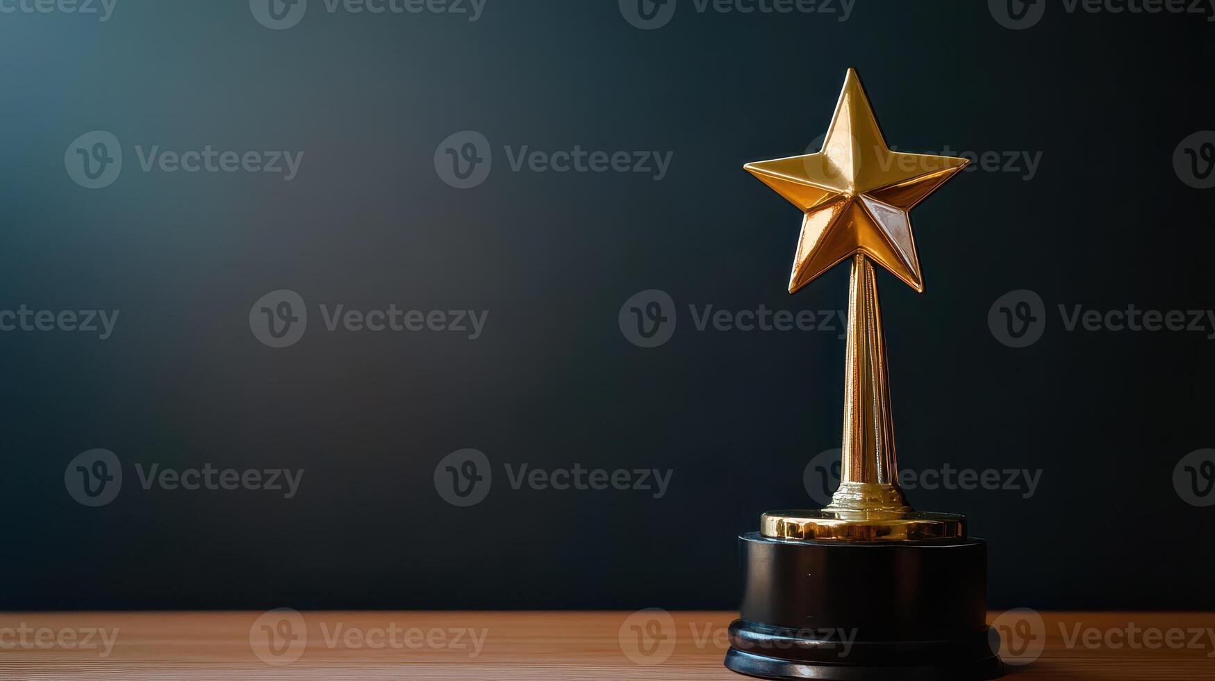 Golden star trophy displayed on a wooden table photo