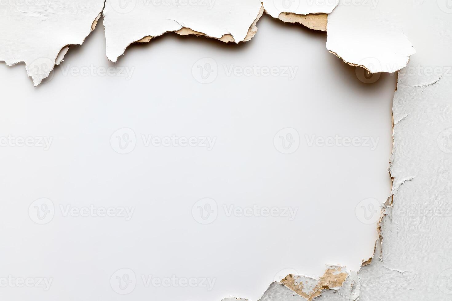 Torn wall revealing damaged surface under paint photo