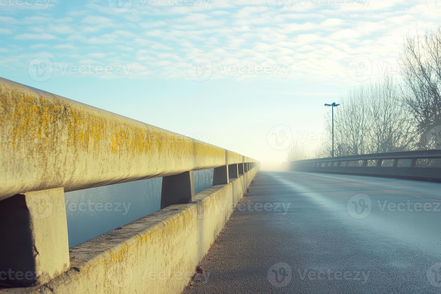 Misty morning on an empty road bridge photo