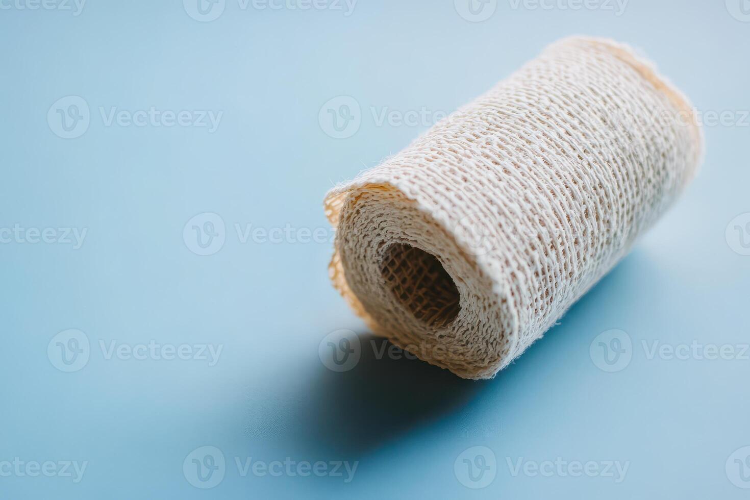 Bandage roll on blue surface for medical use photo