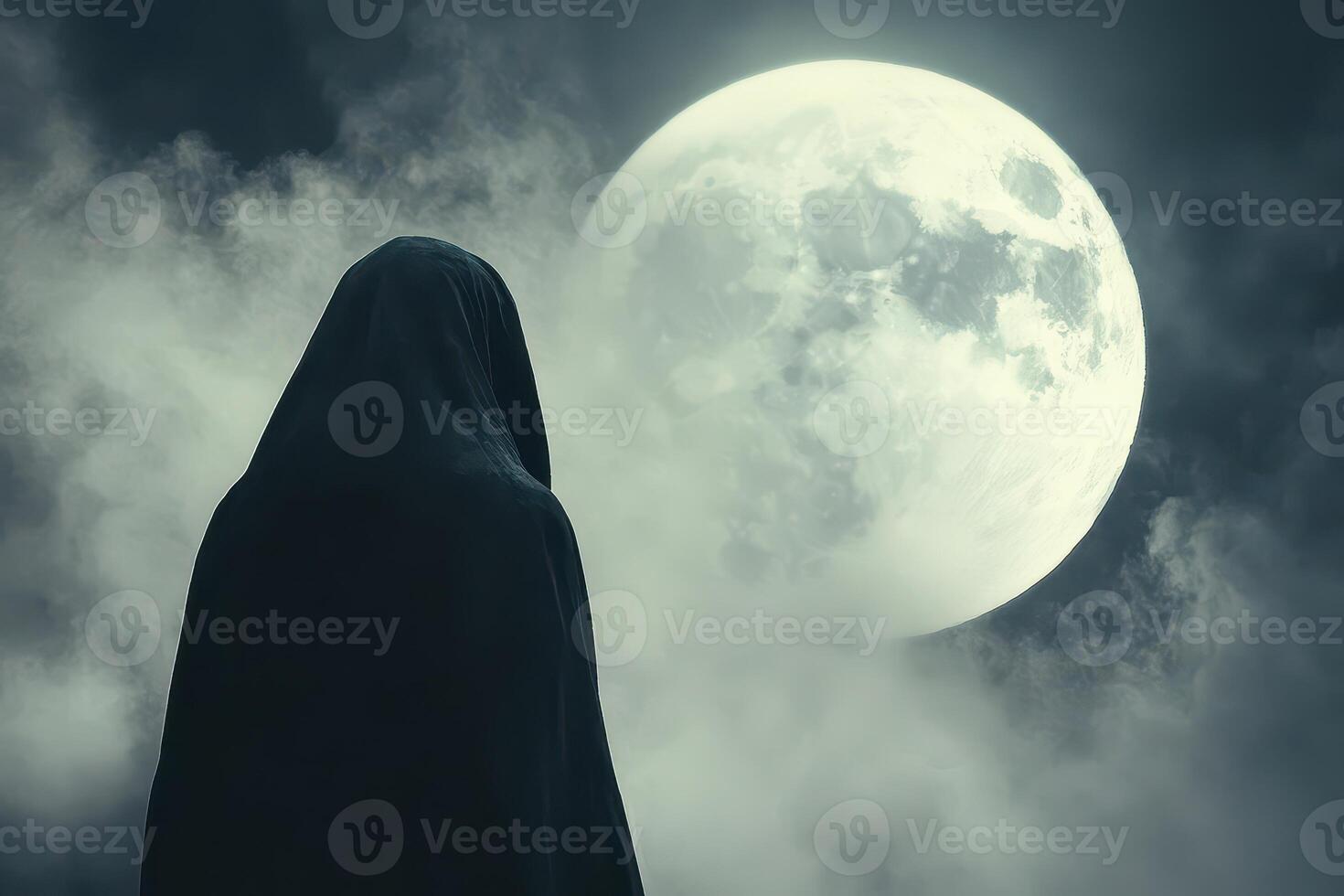 Mysterious figure under the full moon at night photo