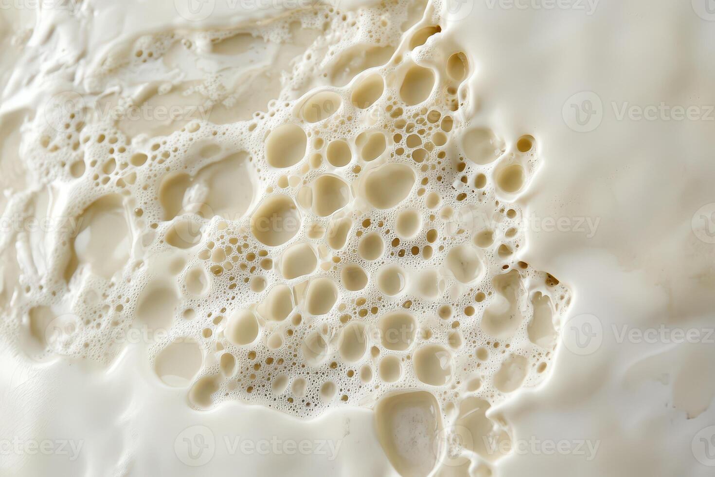 Creamy texture of milk foam during preparation photo