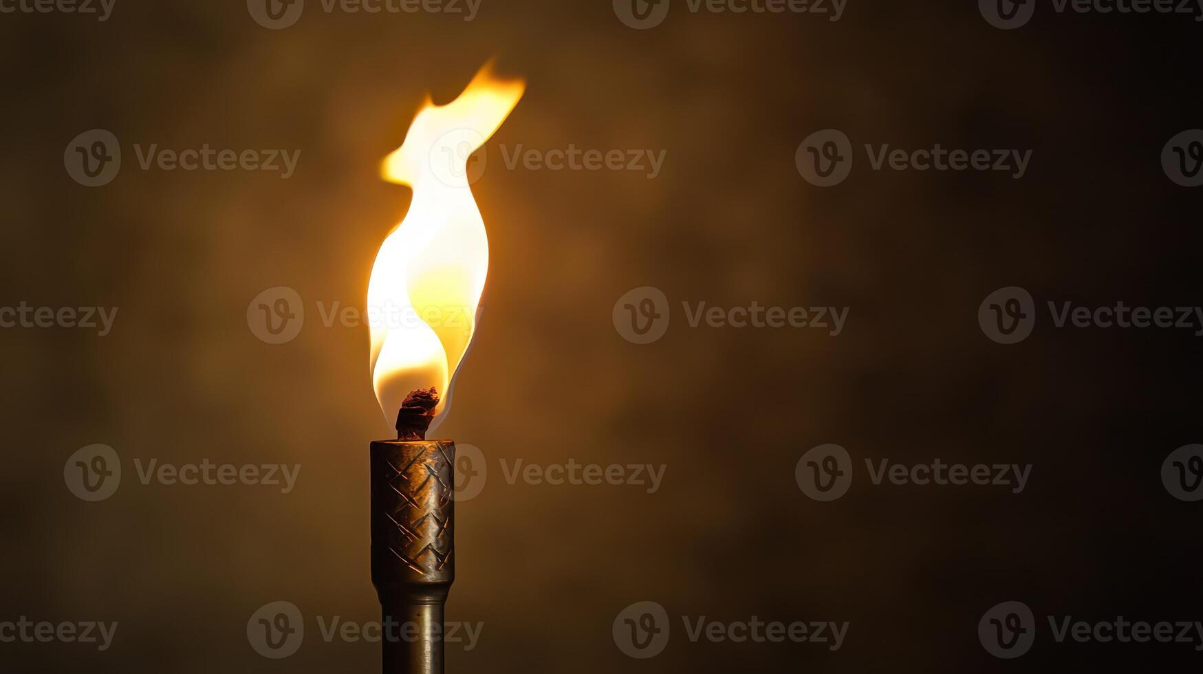 Flickering torch in evening darkness photo