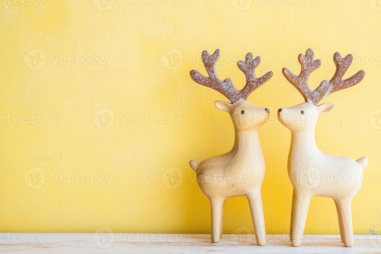 Wooden reindeer on a bright background photo