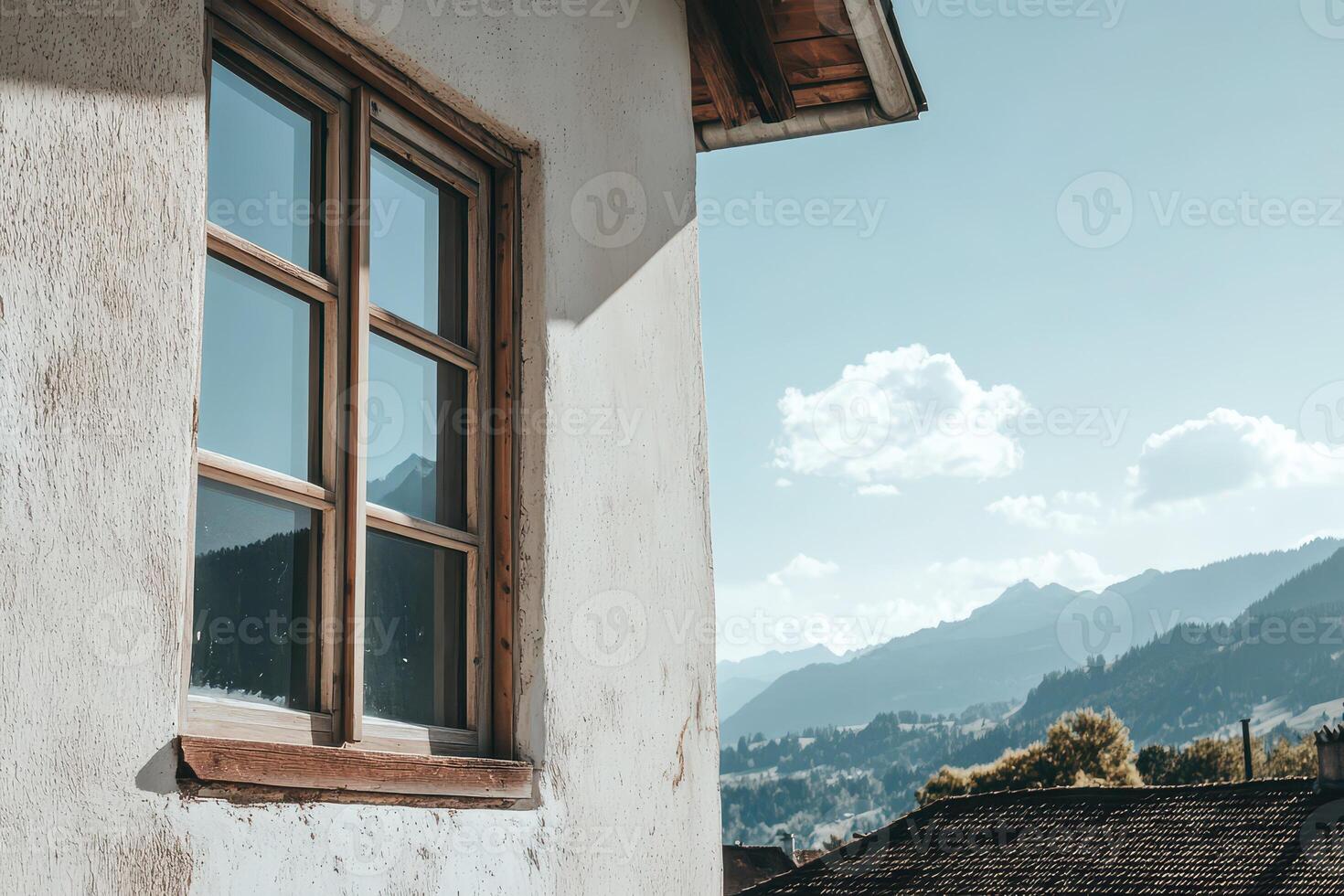 Mountain view through a window at a sunny day photo