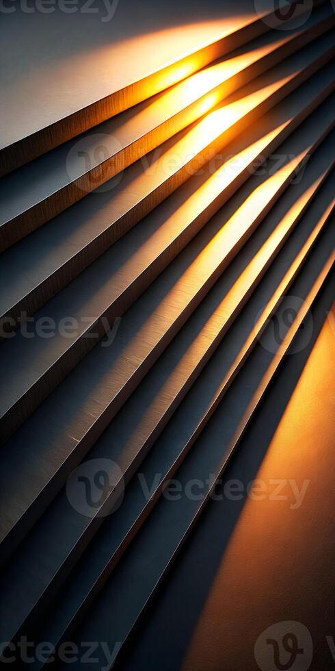 Abstract composition of layered metallic forms with golden light photo
