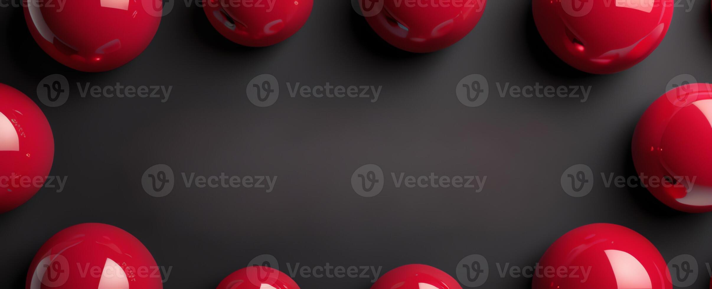 Red glossy spheres arranged on a dark matte surface forming a border with space in the center for text or design photo