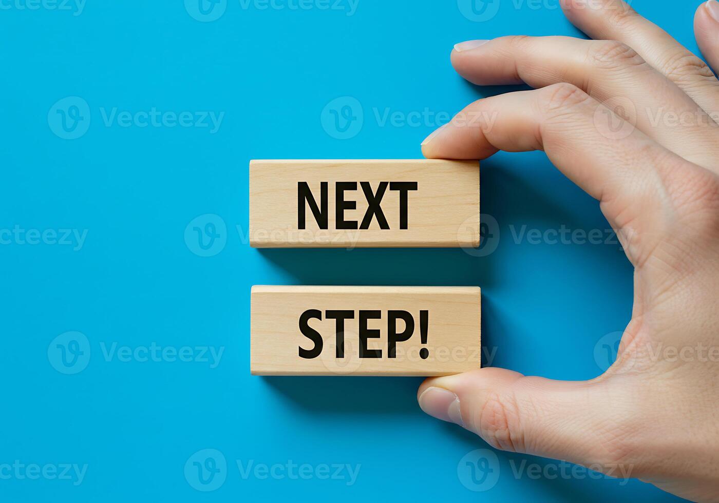 Hand Holding Wooden Block Showing Growth Next Step Motivation photo