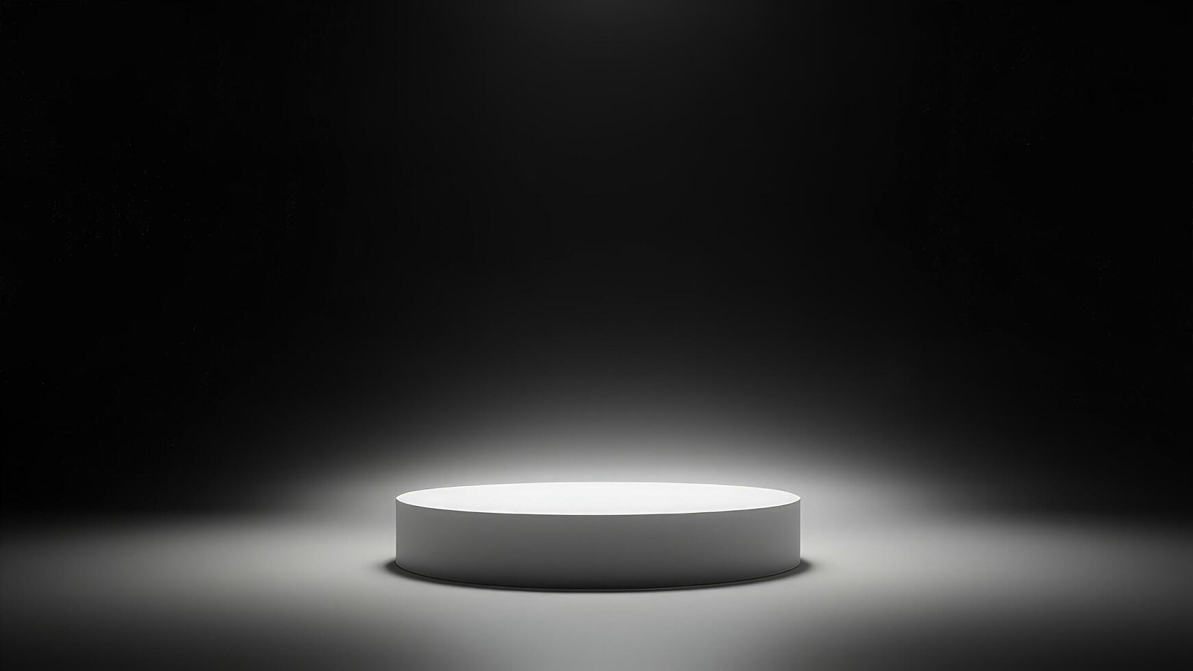 Minimalist white cylinder display pedestal illuminated by soft lighting in a dark environment photo