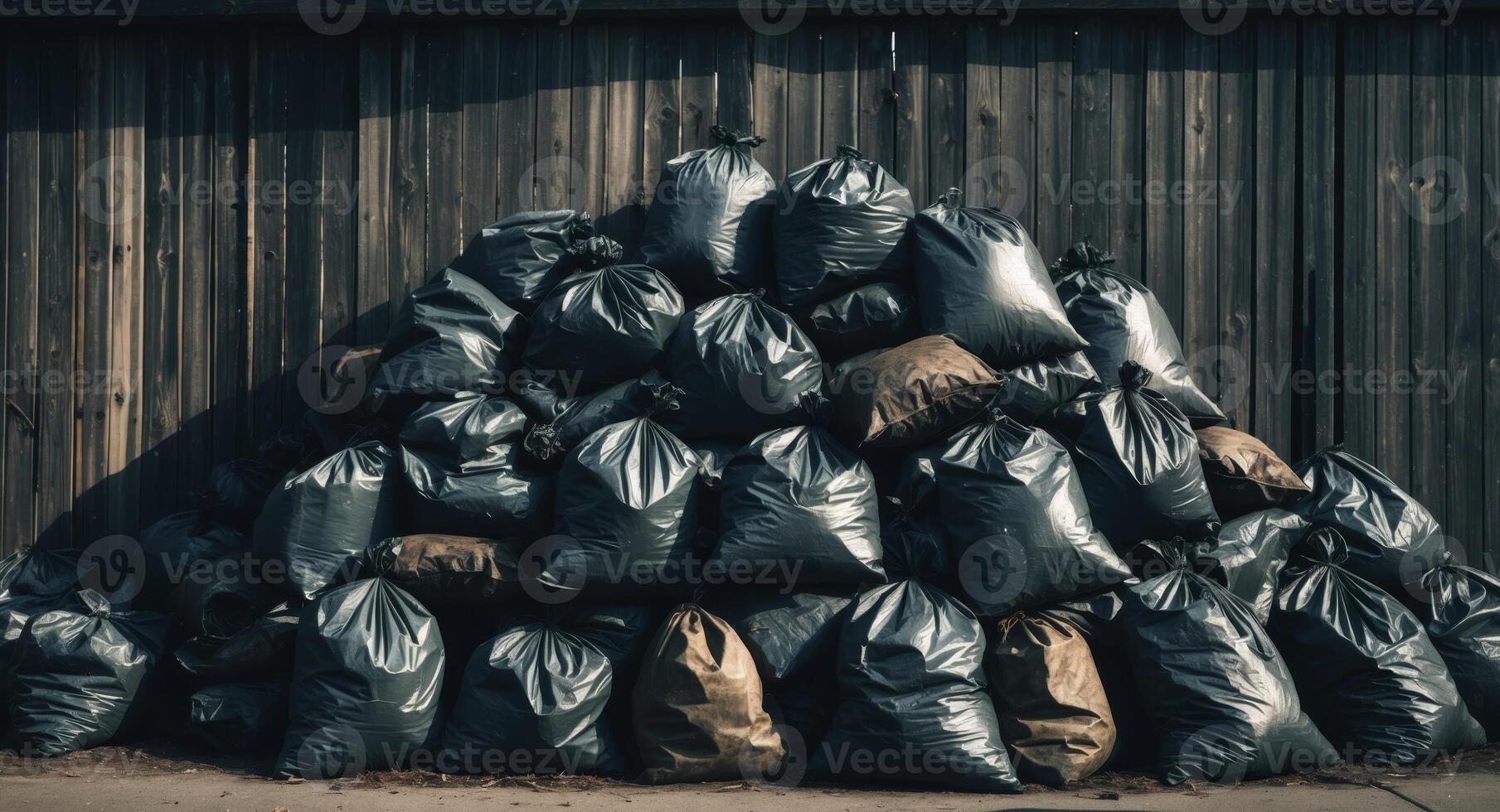 A pile of garbage bags sitting on top of a wooden wall photo