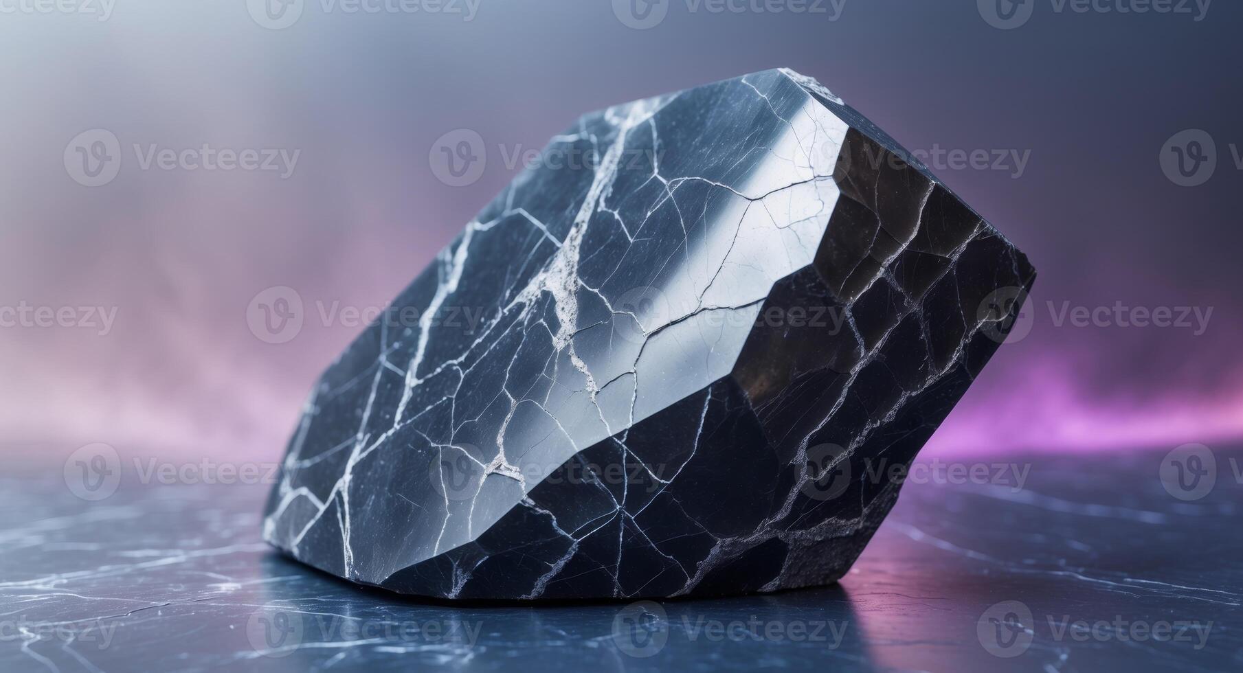 A black marble rock on a table with purple light photo