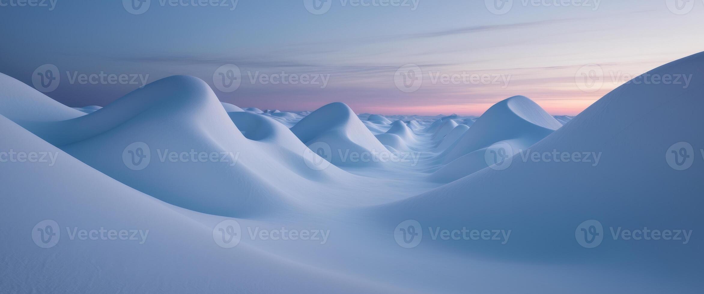 A snow covered mountain range with a sunset in the background photo