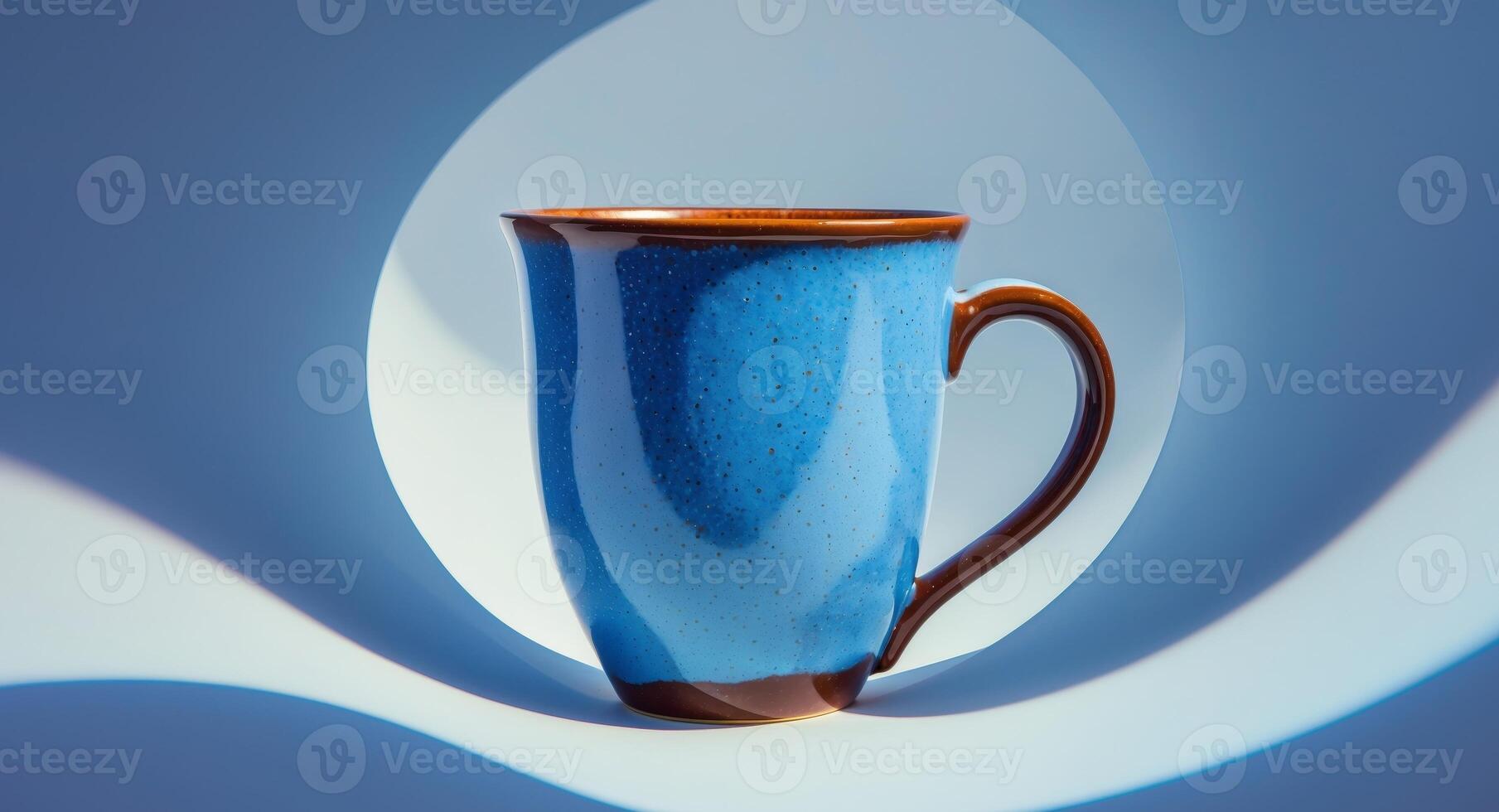 A blue mug sitting on a blue surface photo
