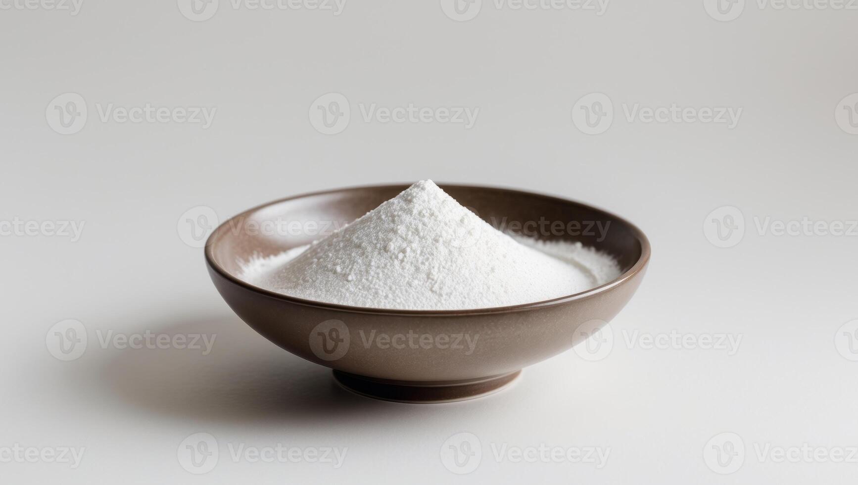 White Powder in a Brown Bowl on a White Background, Minimalist Still Life. photo