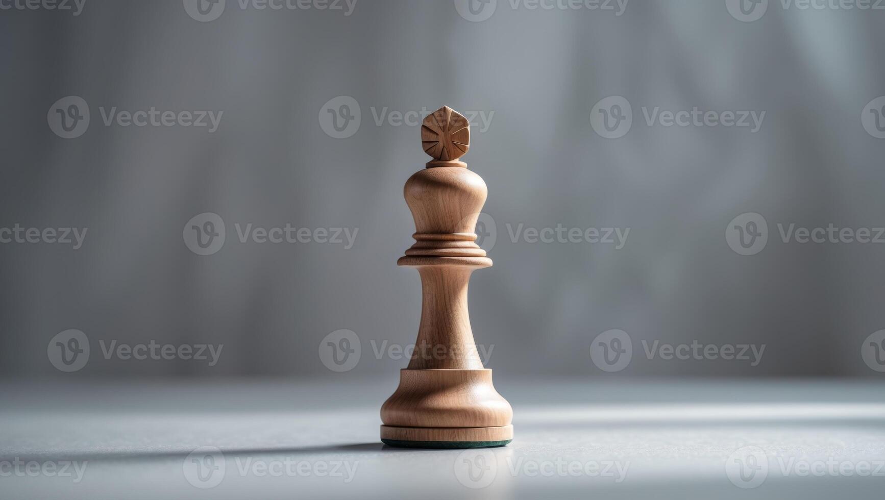 A wooden chess piece on a table photo