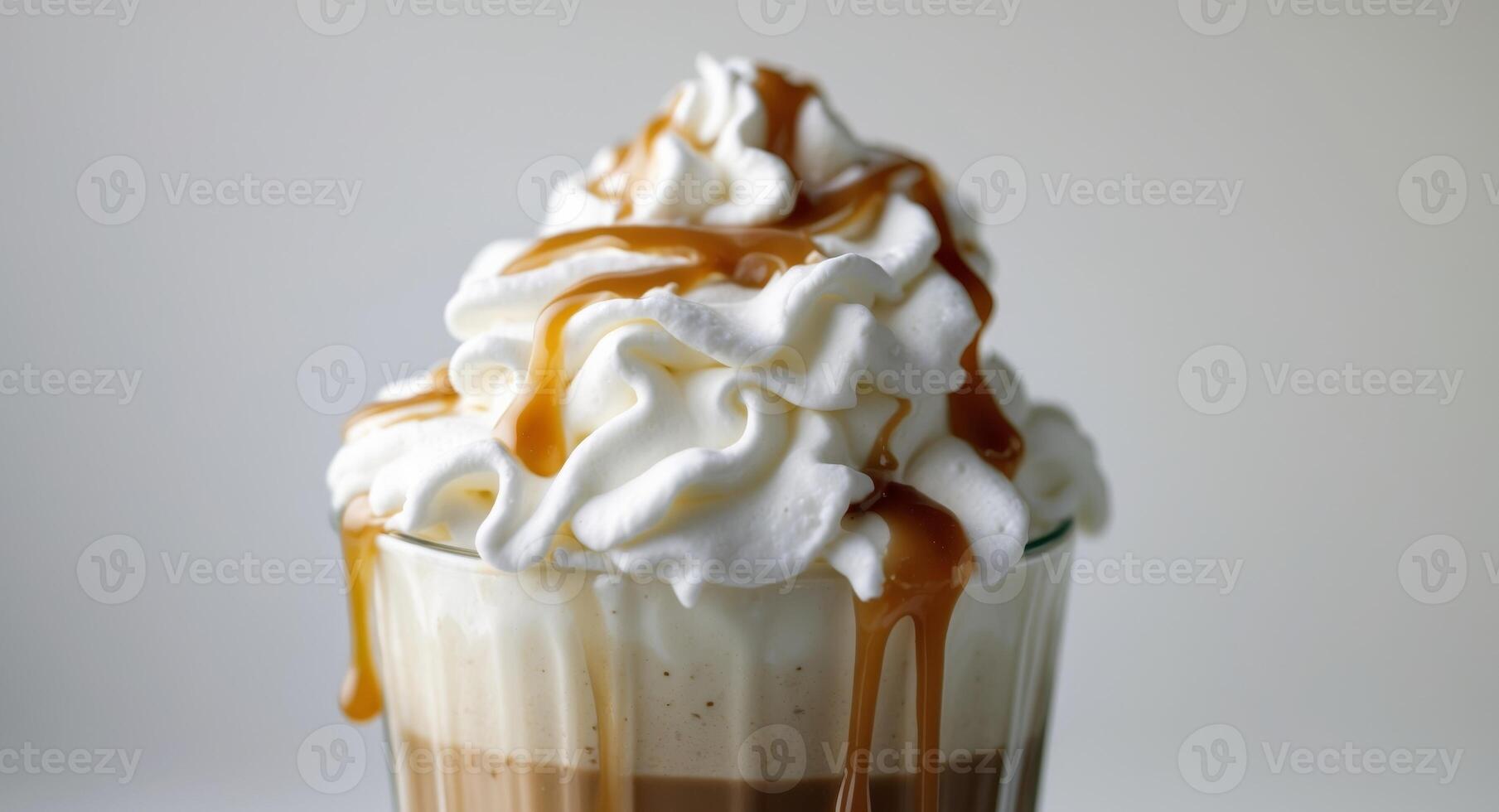 A coffee drink with whipped cream and caramel photo