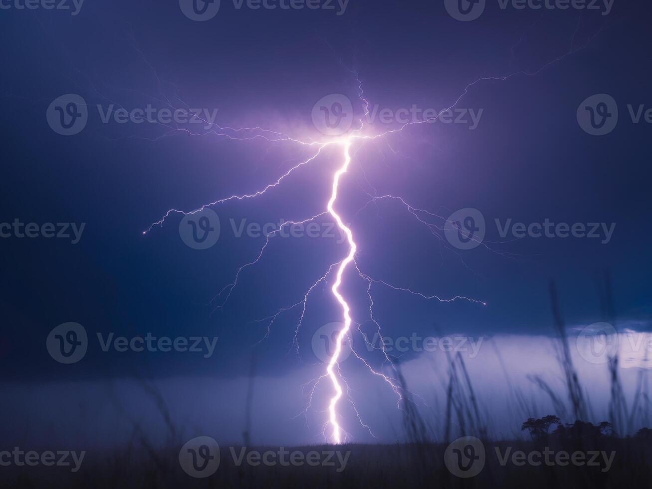 Dramatic Lightning Strike Over Open Field During an Intense Thunderstorm, Night Sky. photo