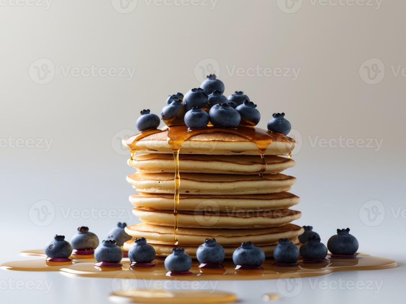 Stack of Fluffy Pancakes Drizzled with Syrup and Topped with Fresh Blueberries photo