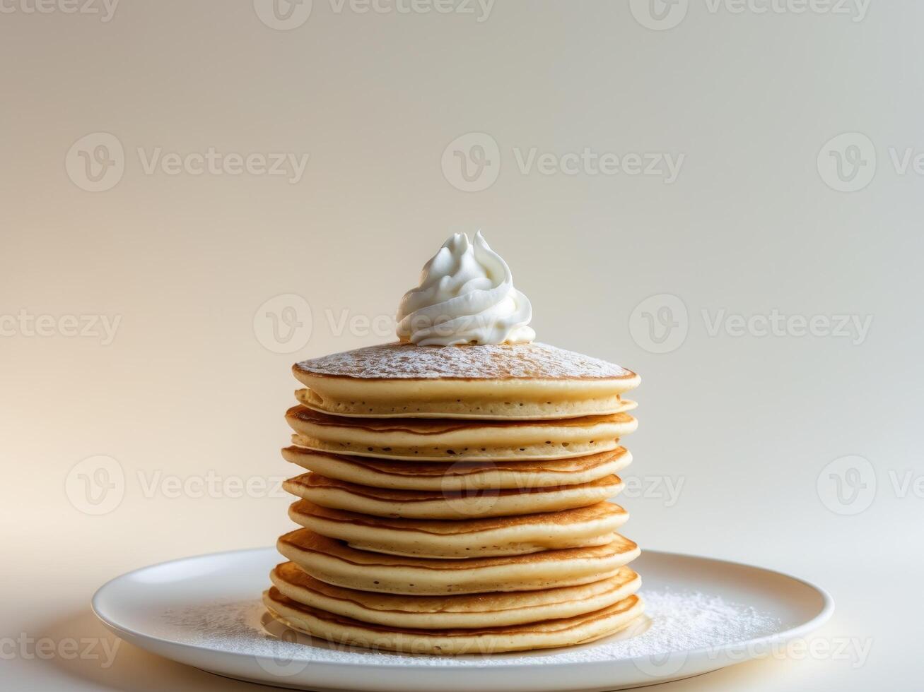 Stack of Delicious Pancakes Topped with Whipped Cream and Powdered Sugar, Closeup photo
