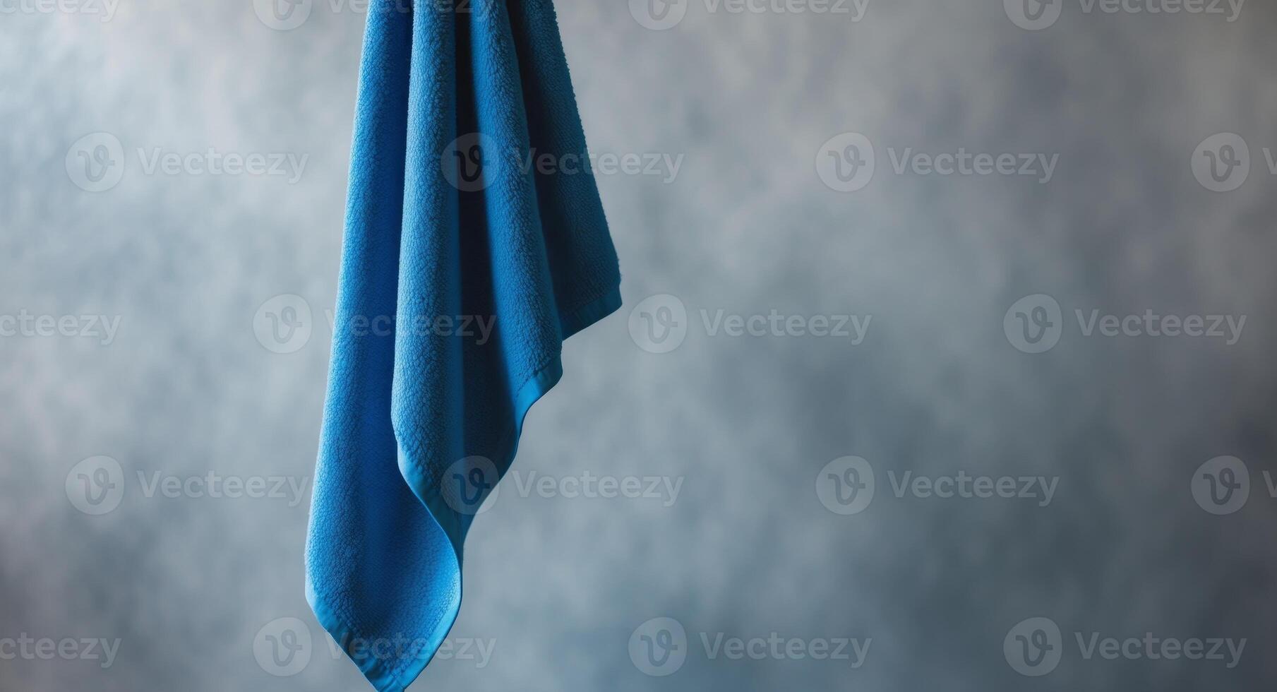 Azure Serenity. A Blue Towel Against a Textured Background, Studio Composition. photo