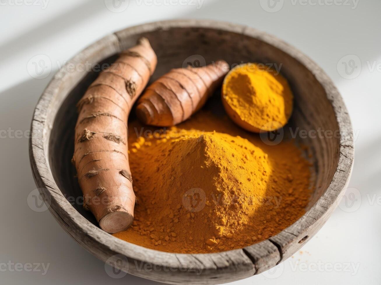 Turmeric Roots and Powder in Rustic Wooden Bowl, Closeup Still Life Composition. photo