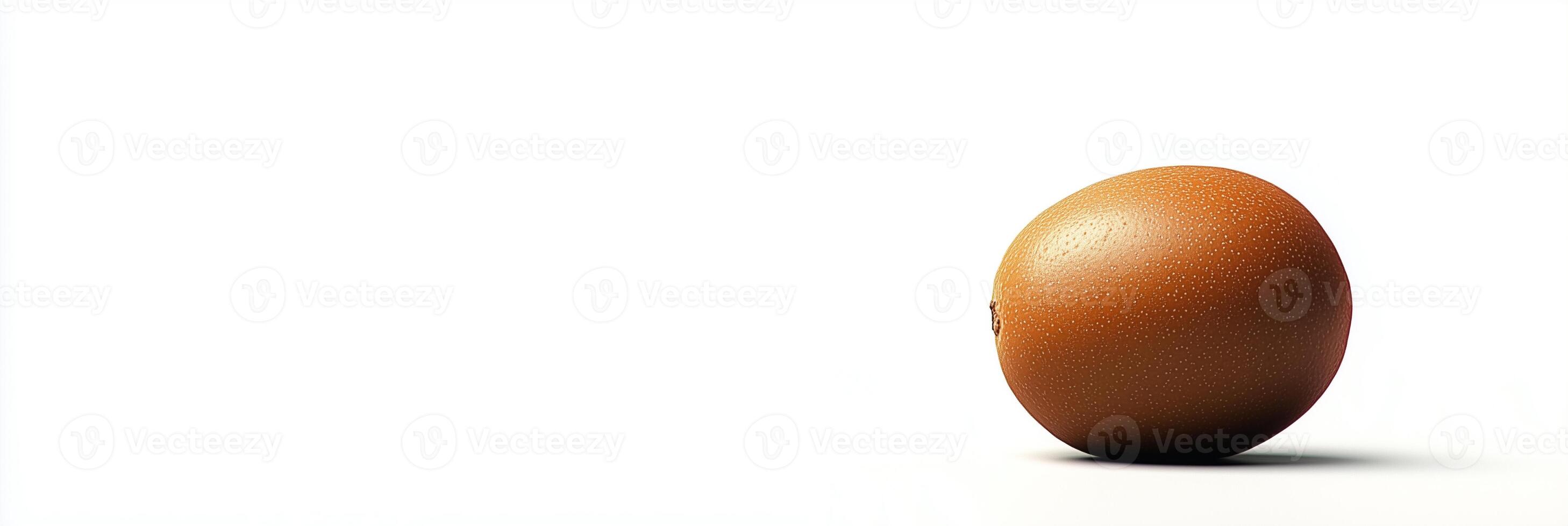 An egg is shown on a white surface photo