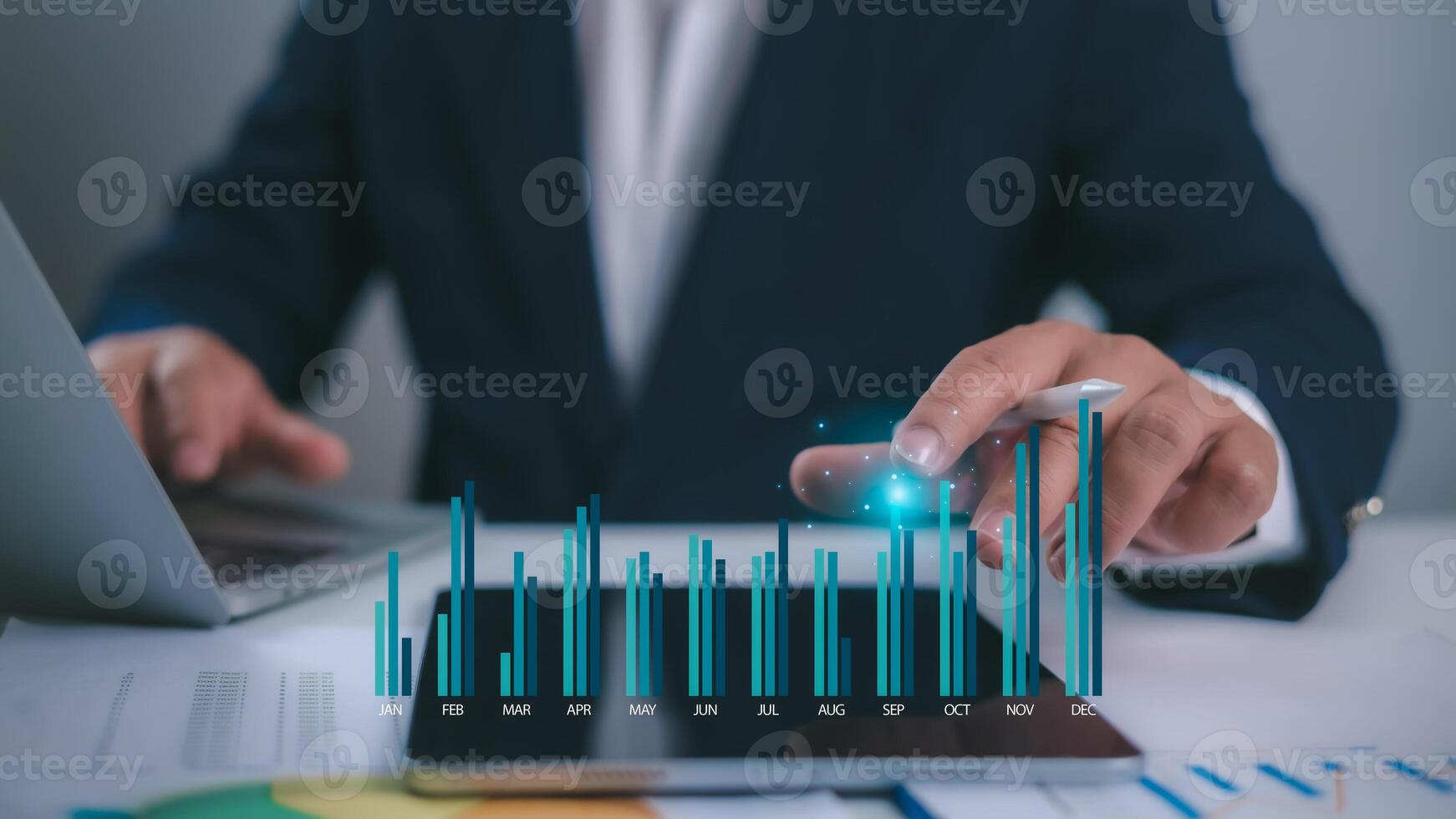 Businessman using laptop and tablet to analyze company growth, Business growth graph this year and future, Development to achieve goals, business trends, Financial information for long-term investment photo