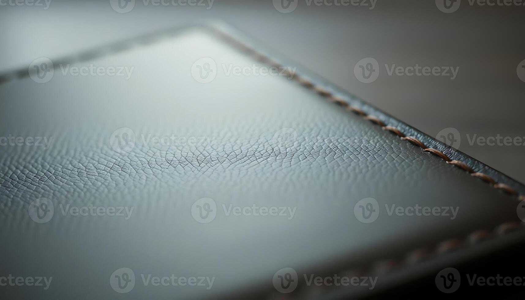 close up of a leather surface with stitching photo