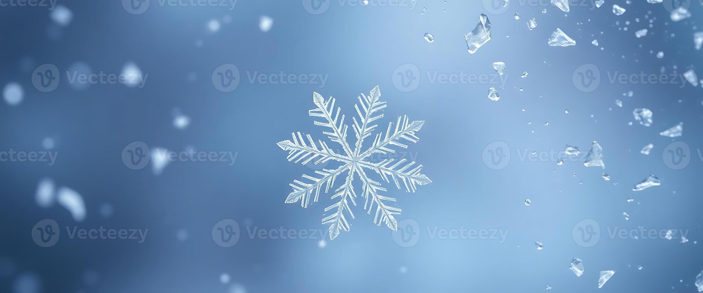 snowflake on a window with drops of water photo