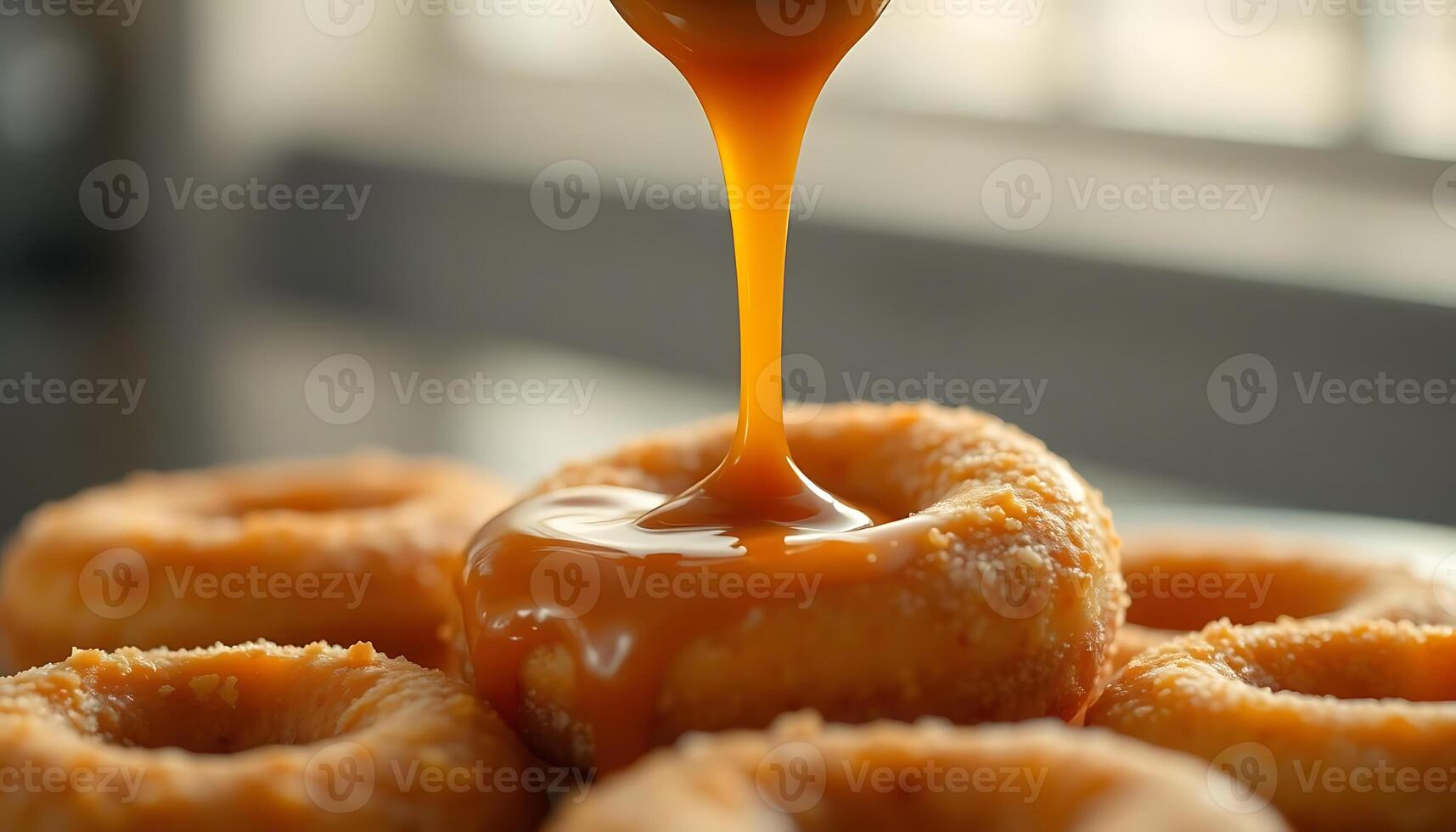 close up of a doughnut with a sauce drizzled on it photo