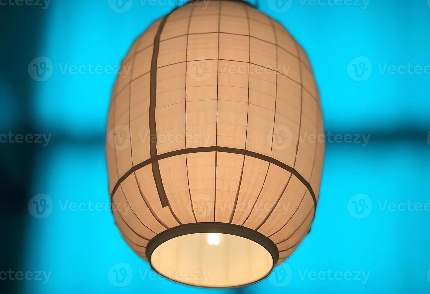 white lamp hanging from a ceiling in a room photo