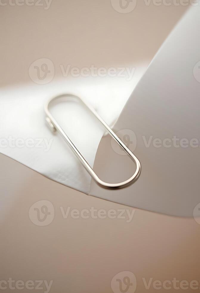 close up of a paper clip on a piece of paper photo