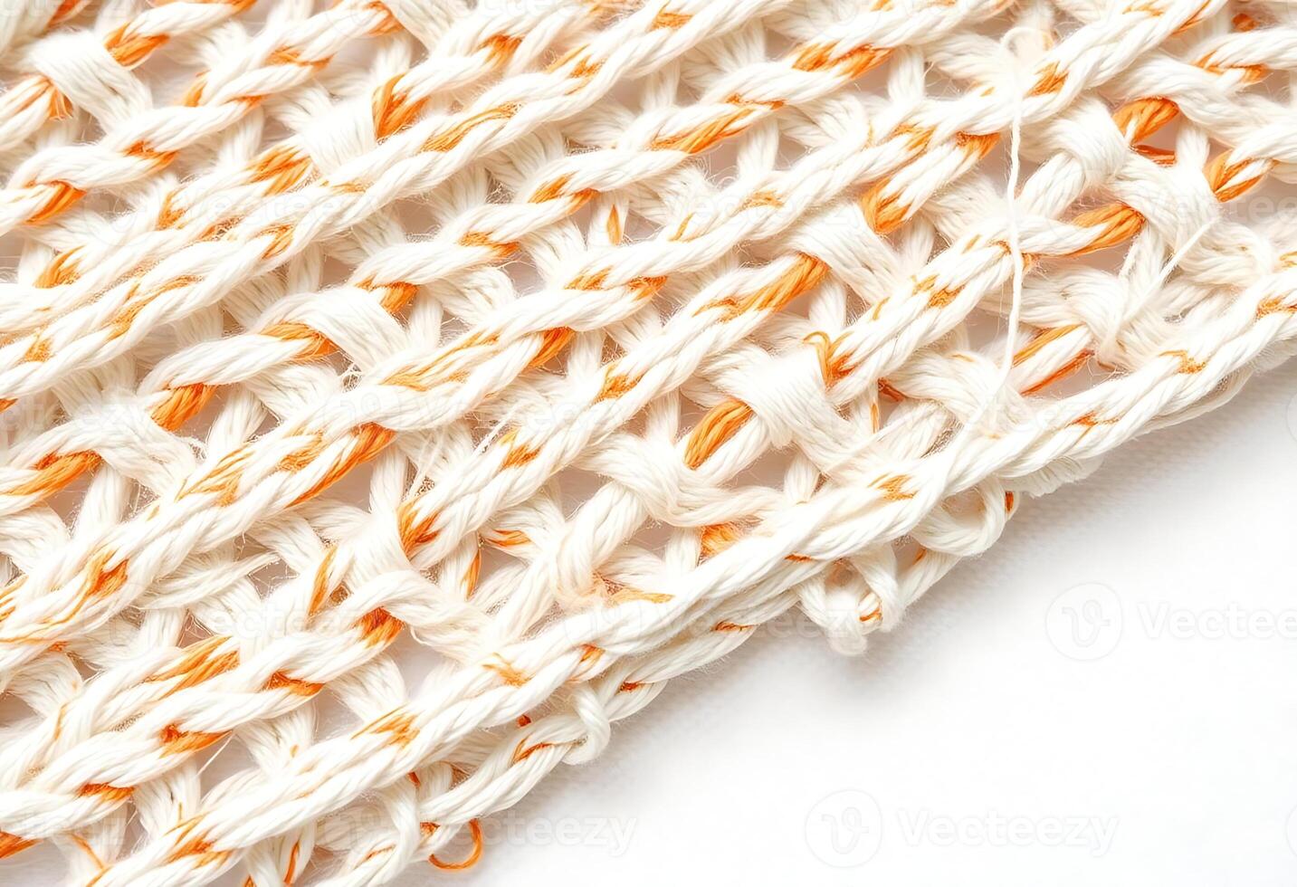 orange and white crochet pattern on a white surface photo