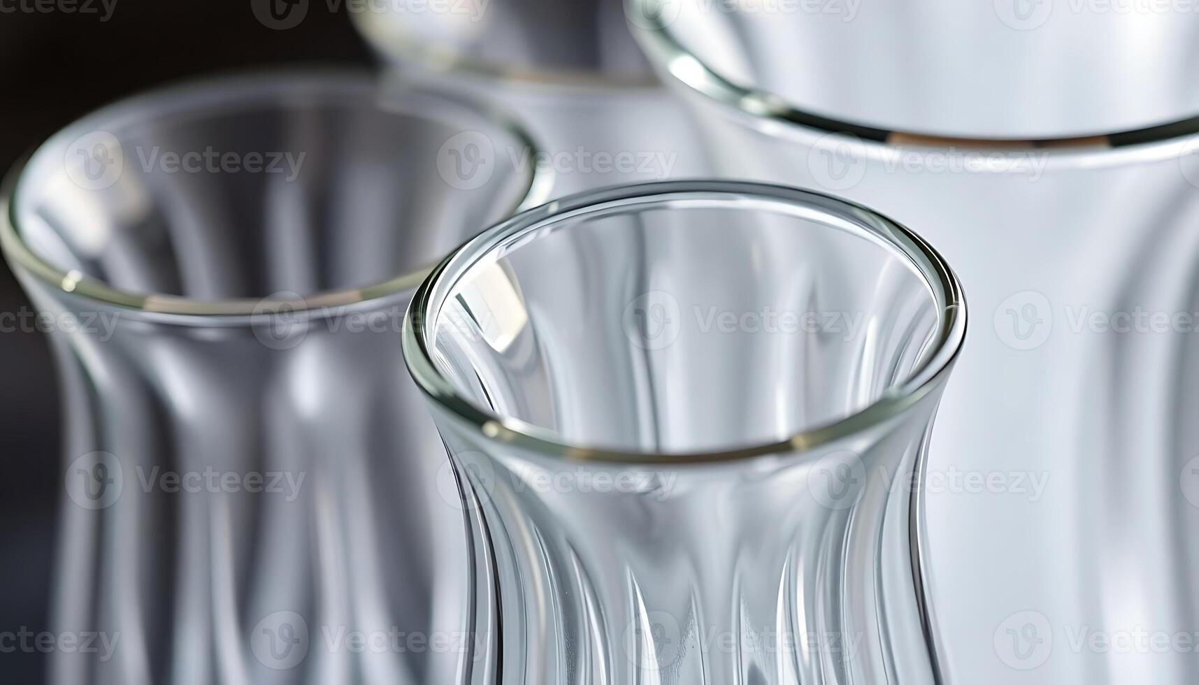 three clear vases sitting next to each other on a table photo