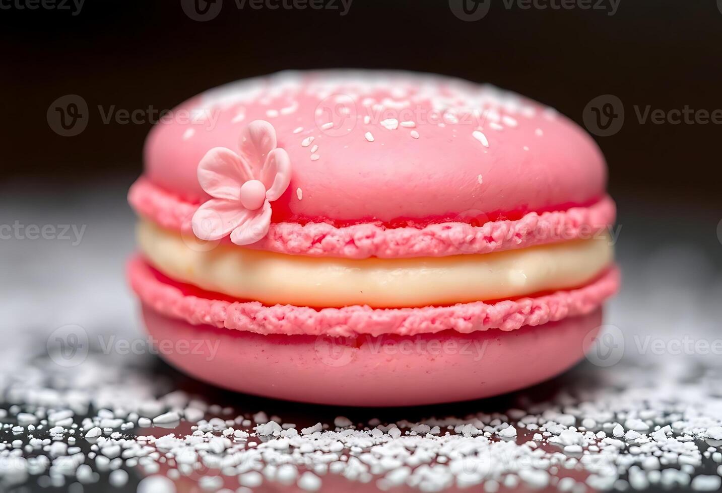 pink macaroon with a flower on top of it photo
