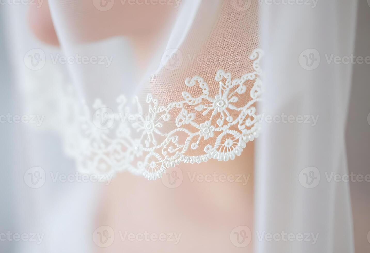close up of a white veil with a lace on it photo