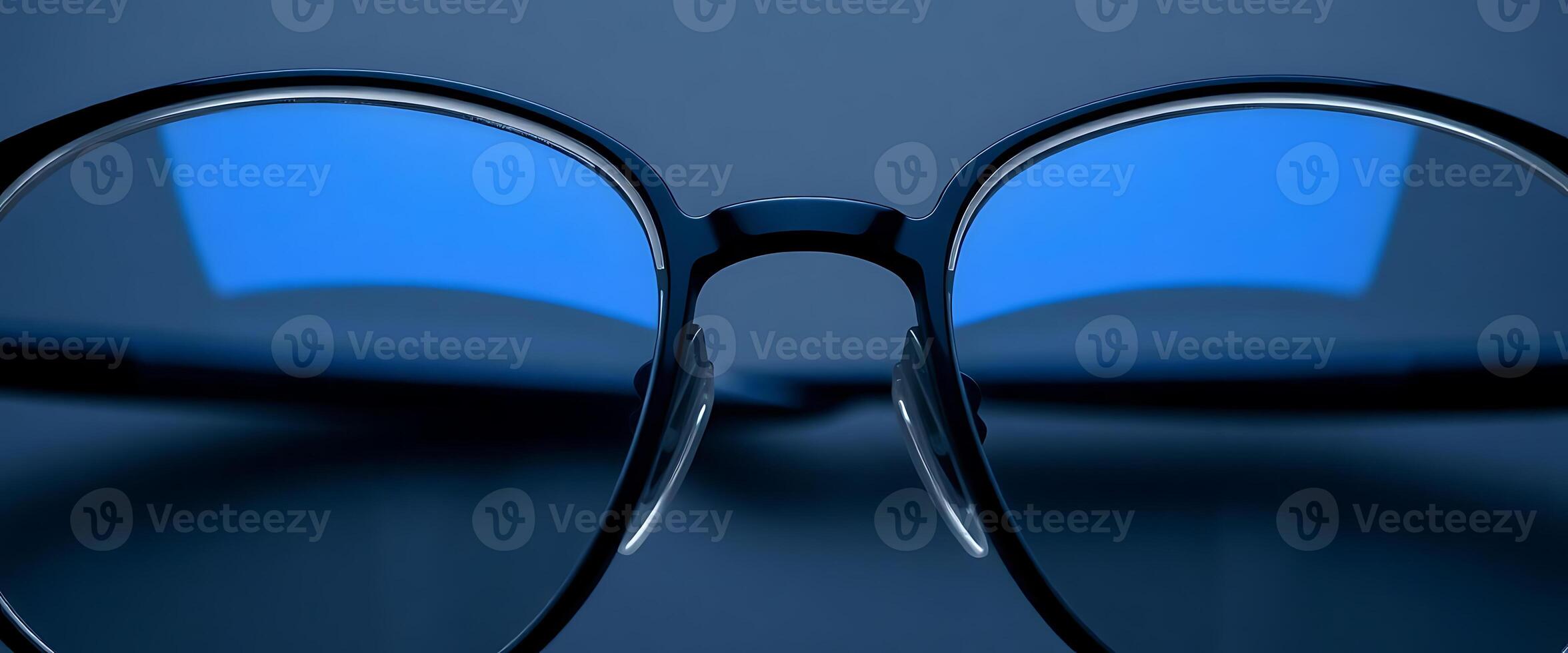 pair of black glasses with blue tinted lenses photo