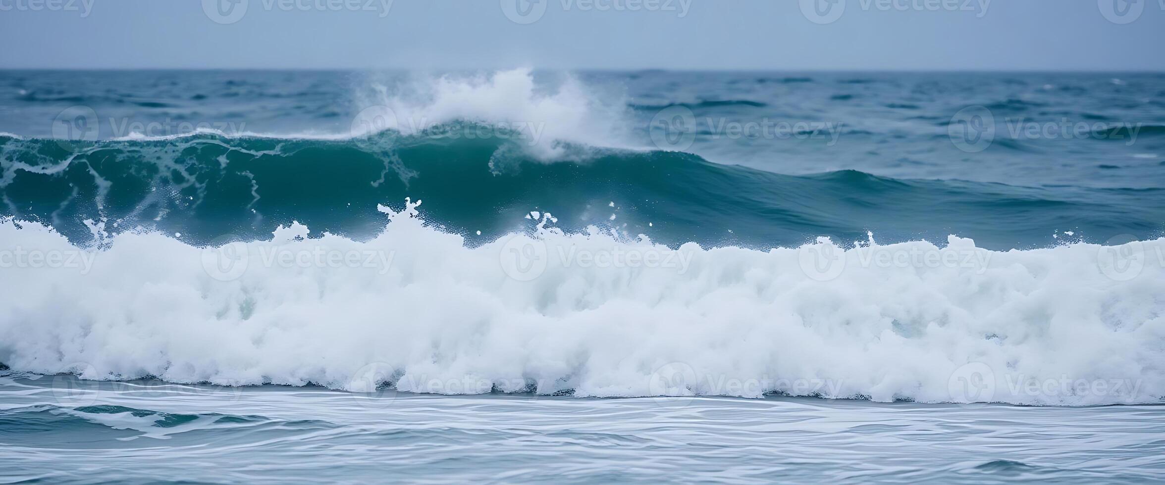large wave is breaking on the ocean photo