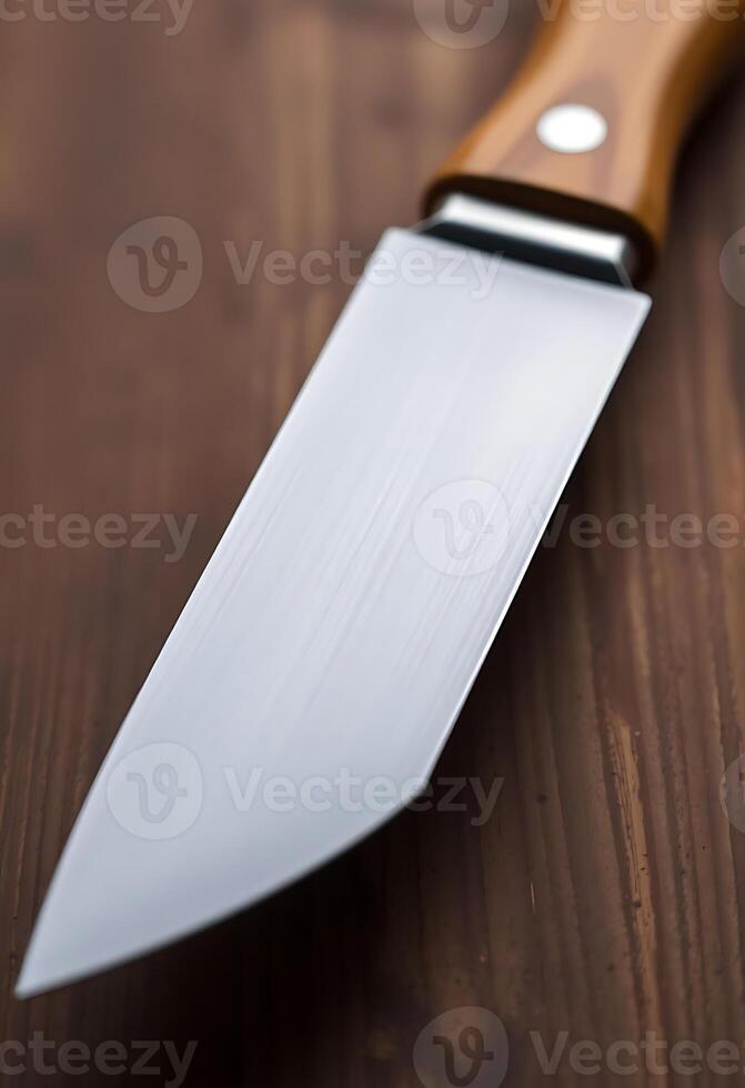 knife with a wooden handle on a wooden table photo