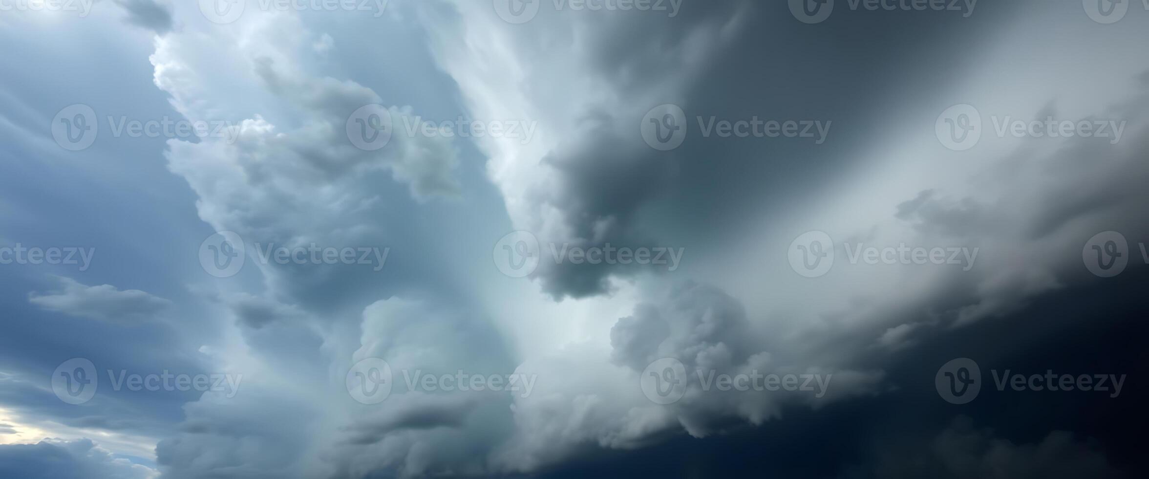 large cloud is in the sky above a beach photo