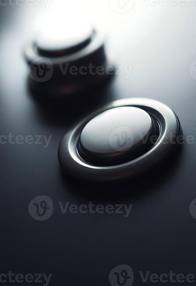 close up of a button on a black surface photo