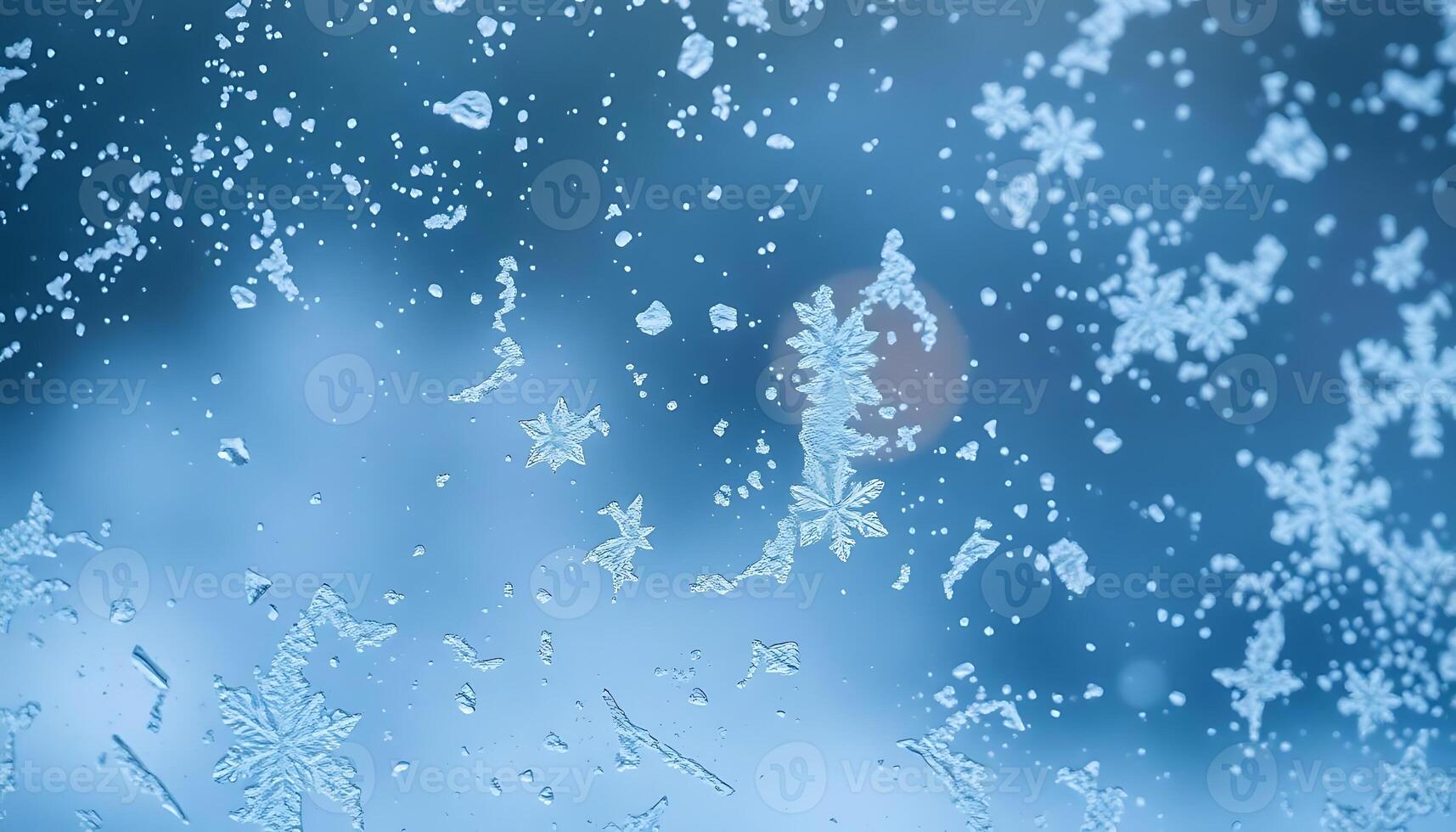close up of a window with snow flakes on it photo